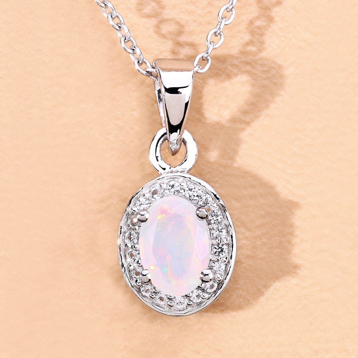 0.46 Carat Genuine Ethiopian Opal and Created White Sapphire .925 Sterling Silver Pendant