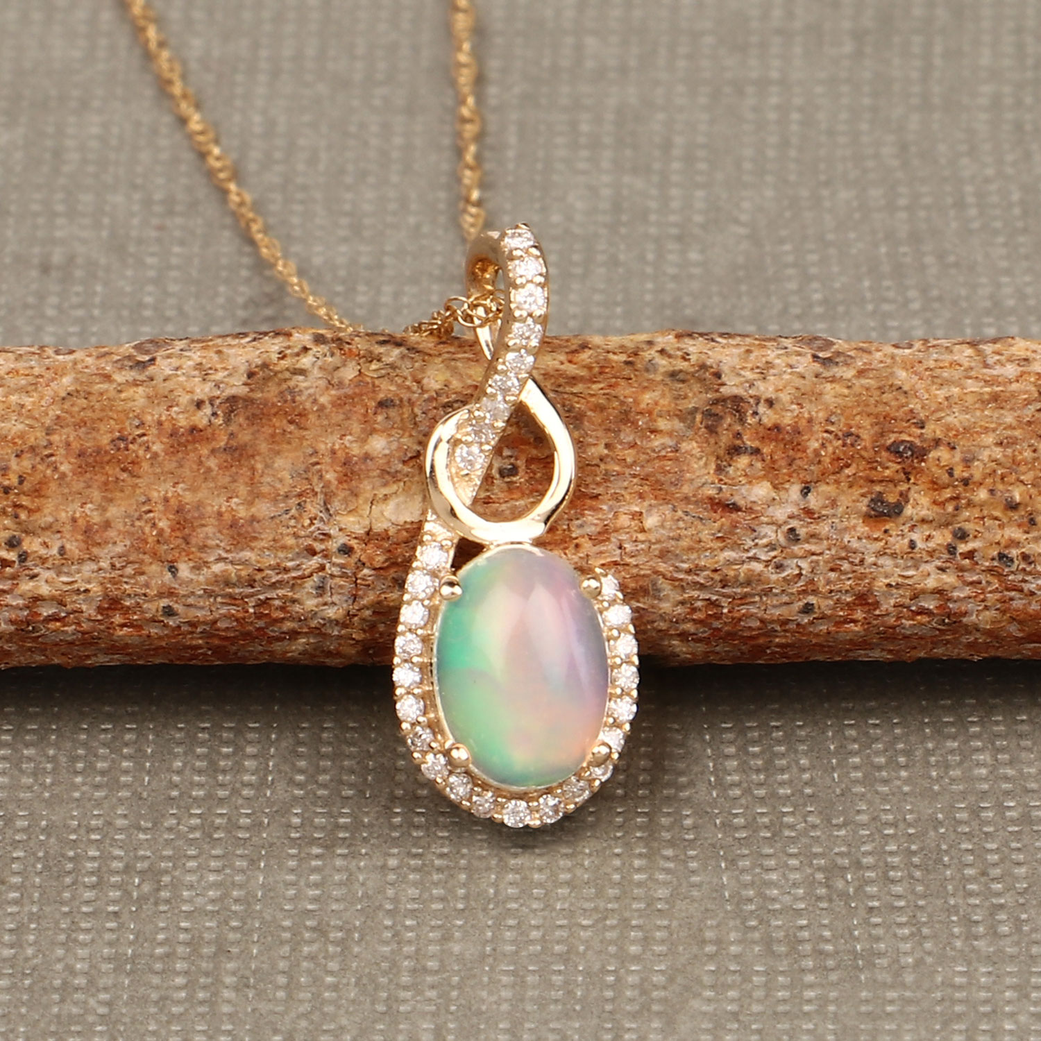 0.56 Carat Genuine Ethiopian Opal and White Diamond 14K Yellow Gold Pendant